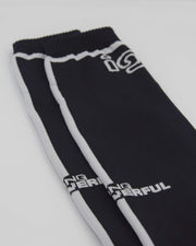 Calzini lunghi neri con logo bianco IGS dettaglio pulito